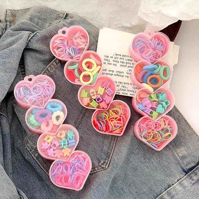 A set of hair ties with 4 transparent heart-shaped storage cases